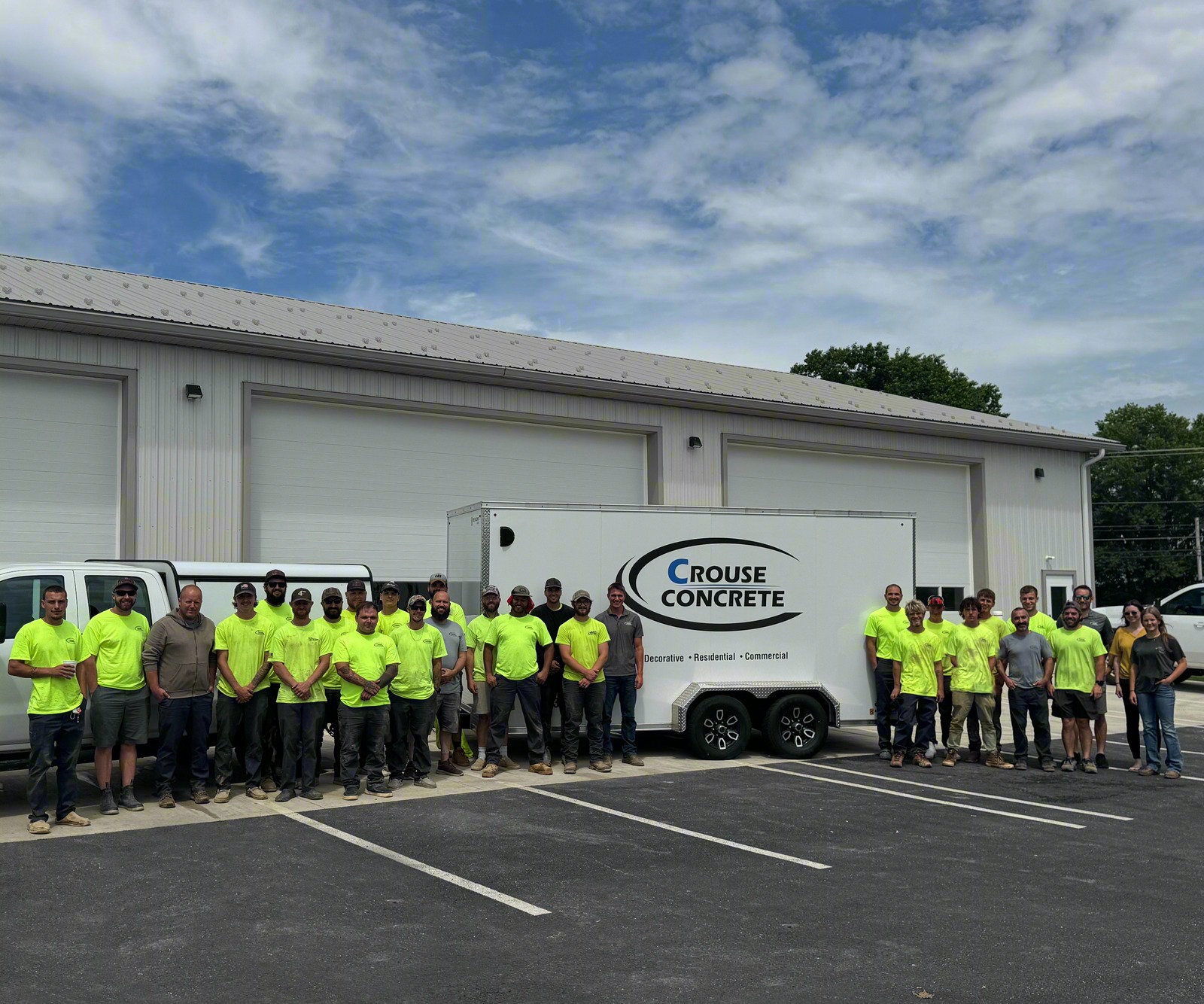 The Crouse Concrete crew outside the shop with the company trailer.