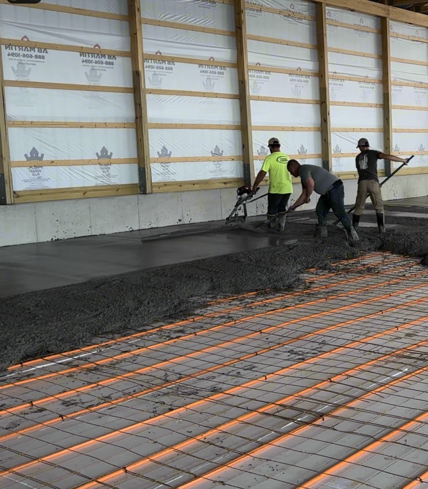 Crew Pouring a Heated Barn Slab