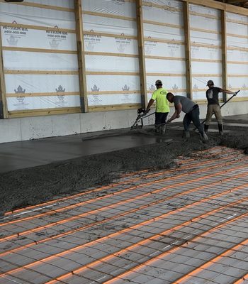 Crew Pouring a Heated Slab